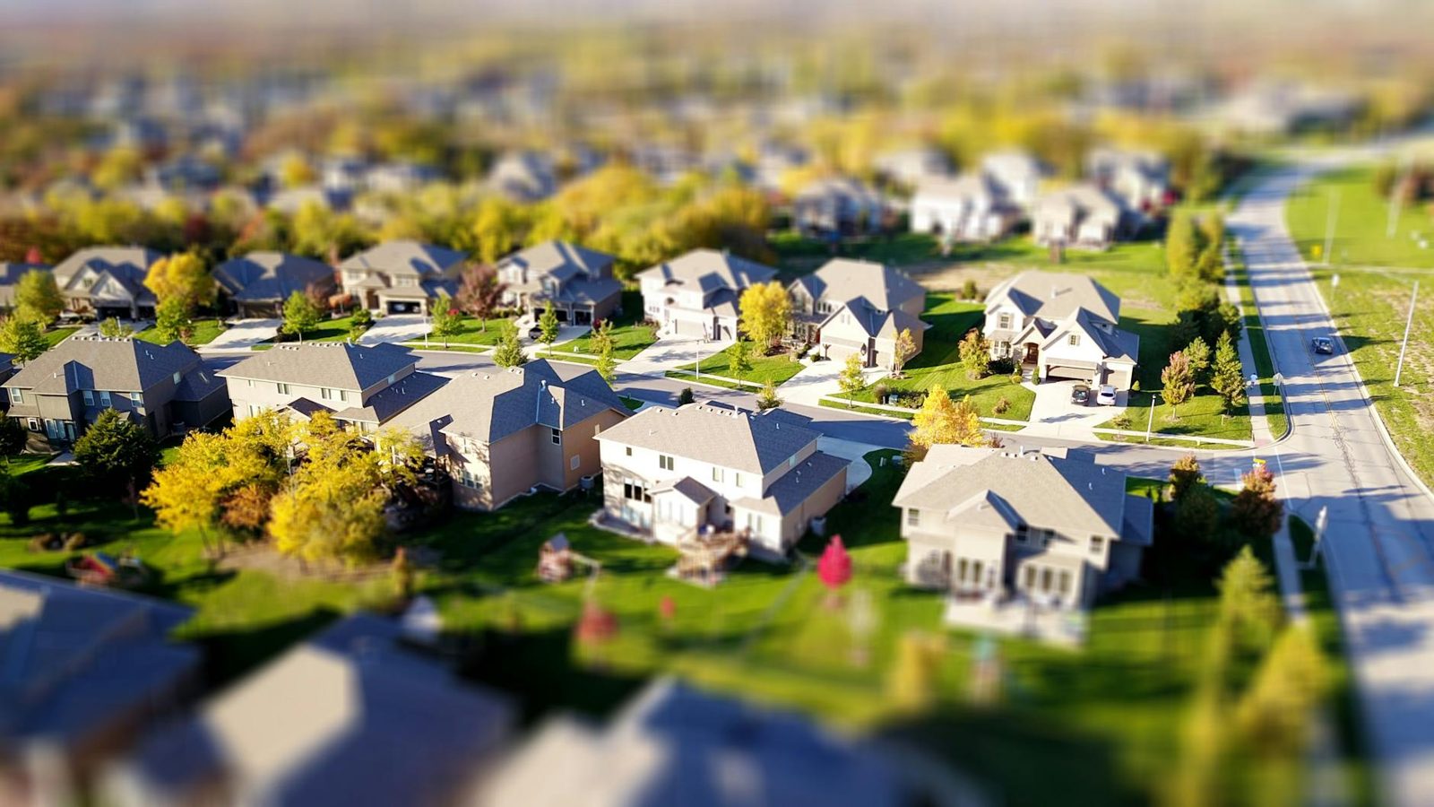 Aerial view of a suburban neighborhood — location is the largest driver of home value.