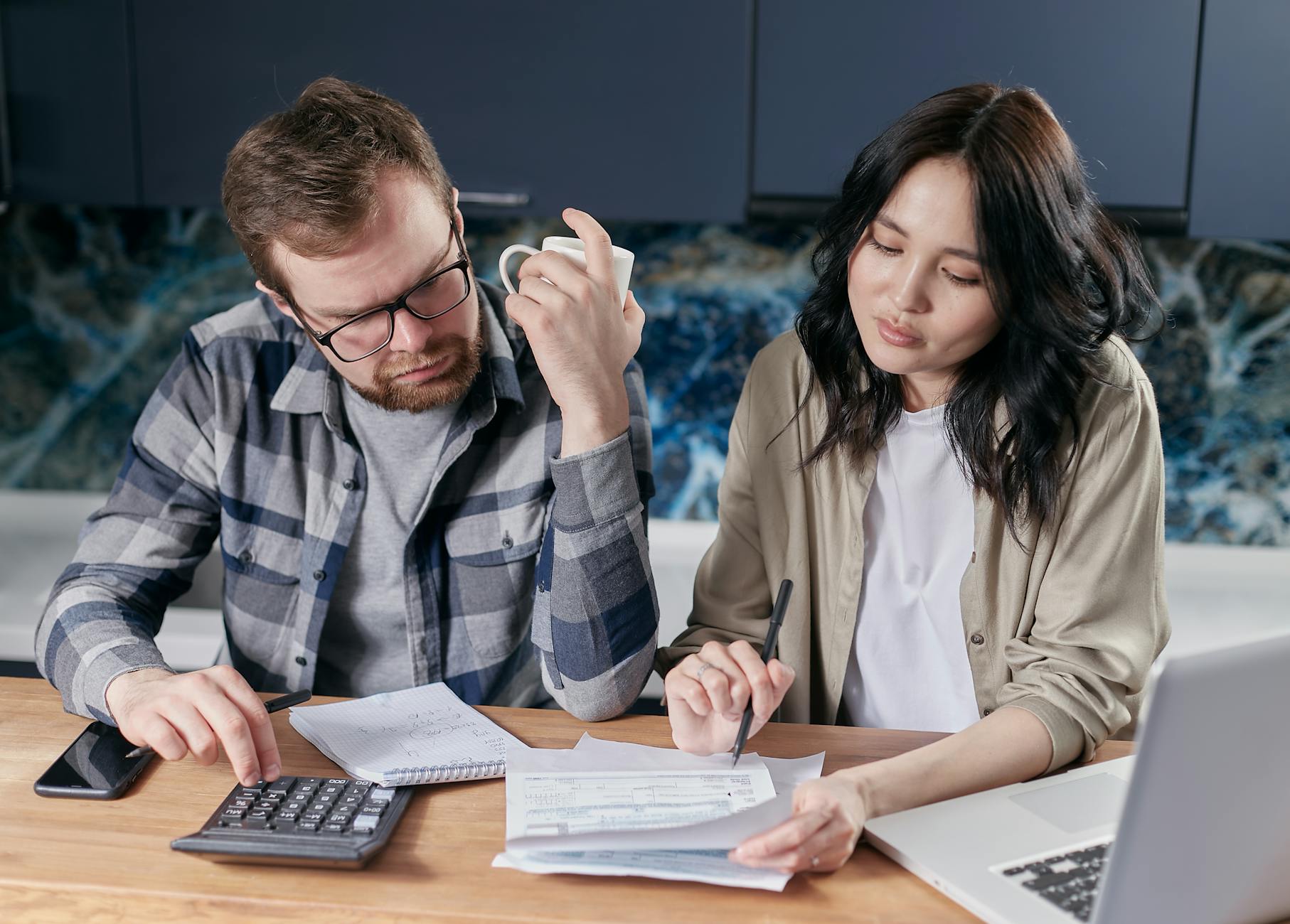 Homebuyer reviewing paperwork while planning a twelve-month home buying timeline