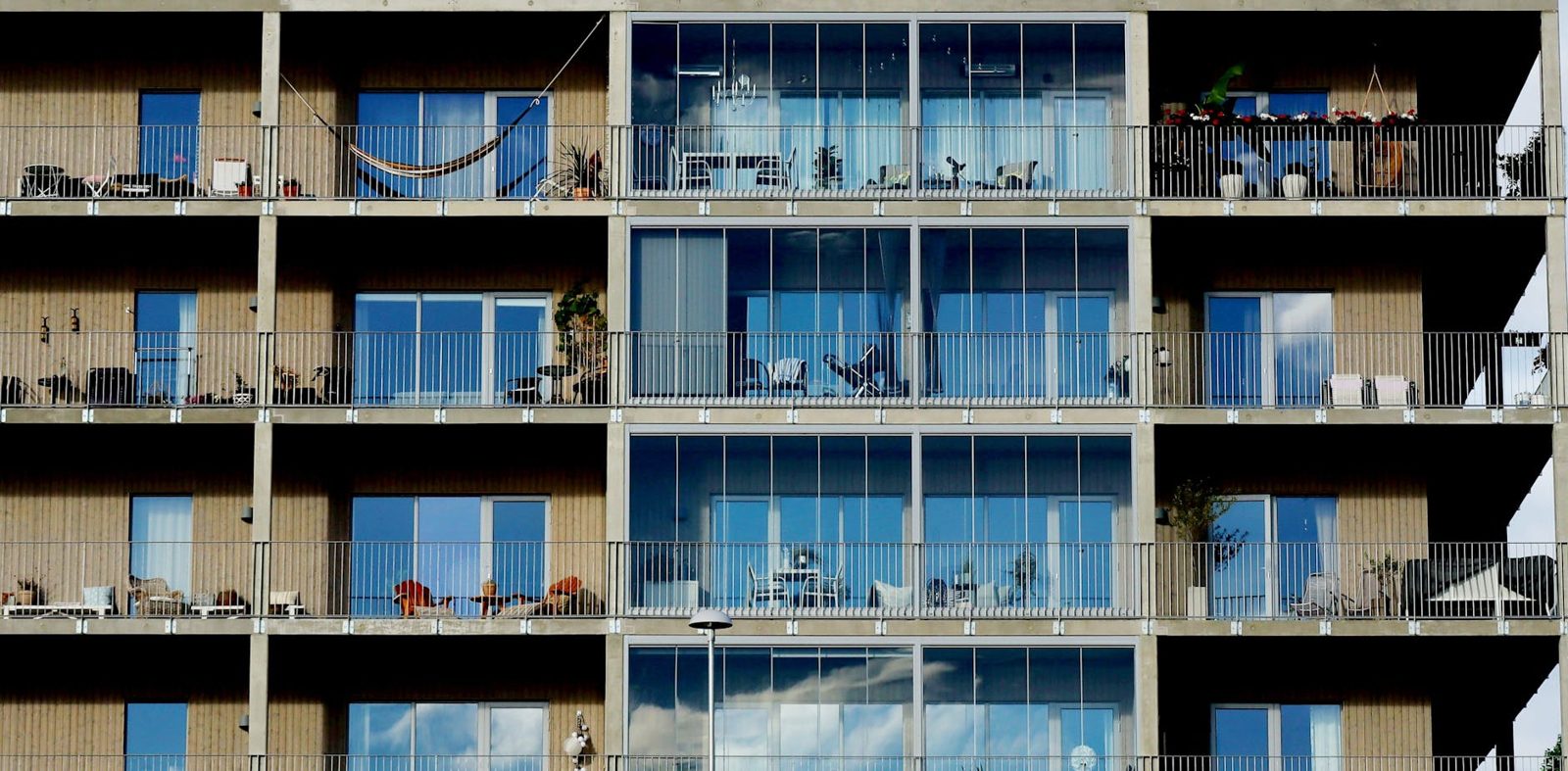 Apartment building exterior in an urban neighborhood — renting still wins the math in many cities right now.