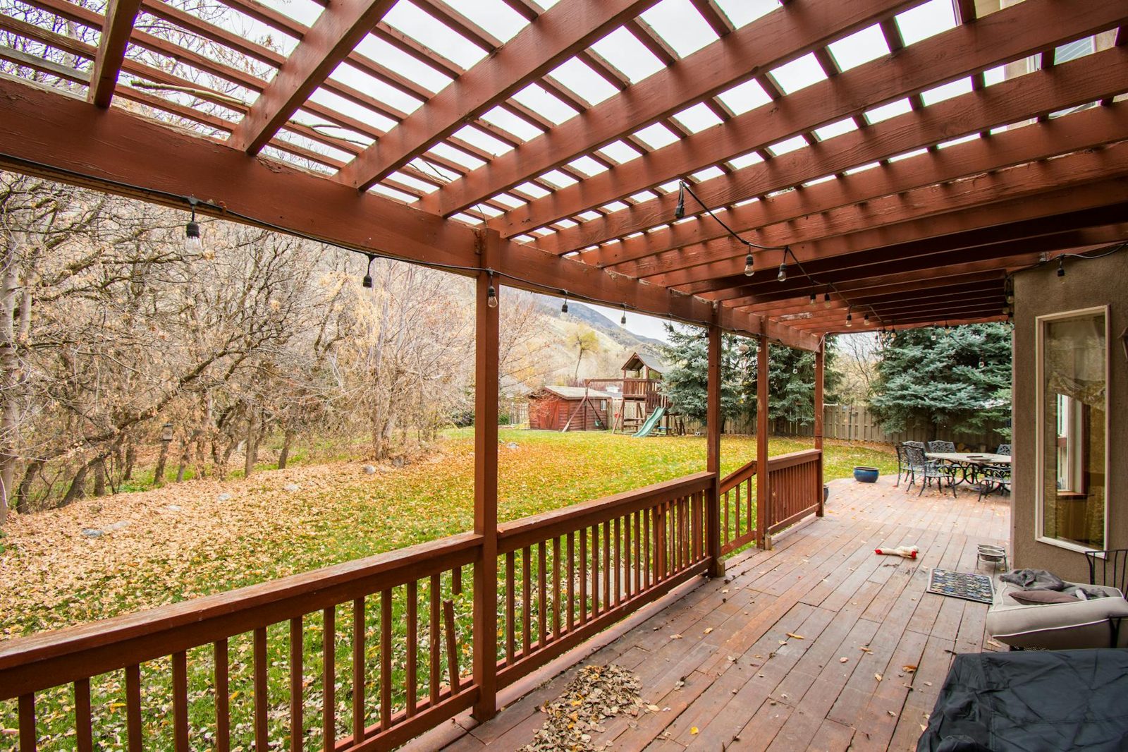 Backyard deck and patio illustrating outdoor living space that adds to home value.