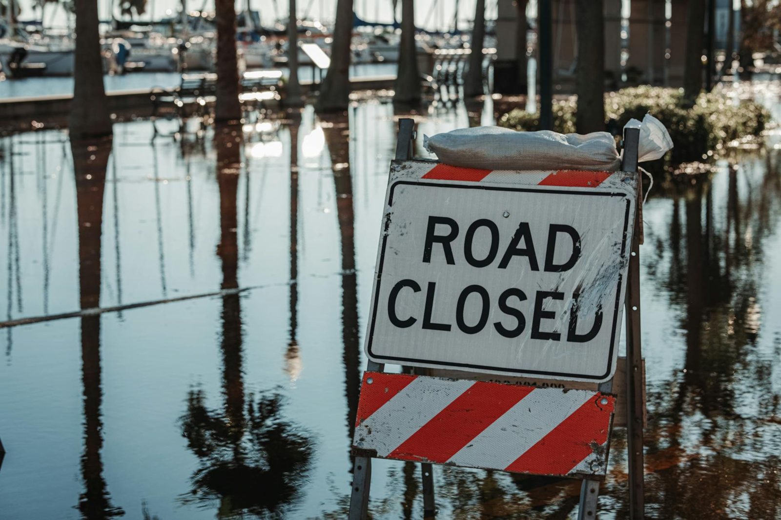 Flooded coastal street and storm damage in the aftermath of a hurricane.