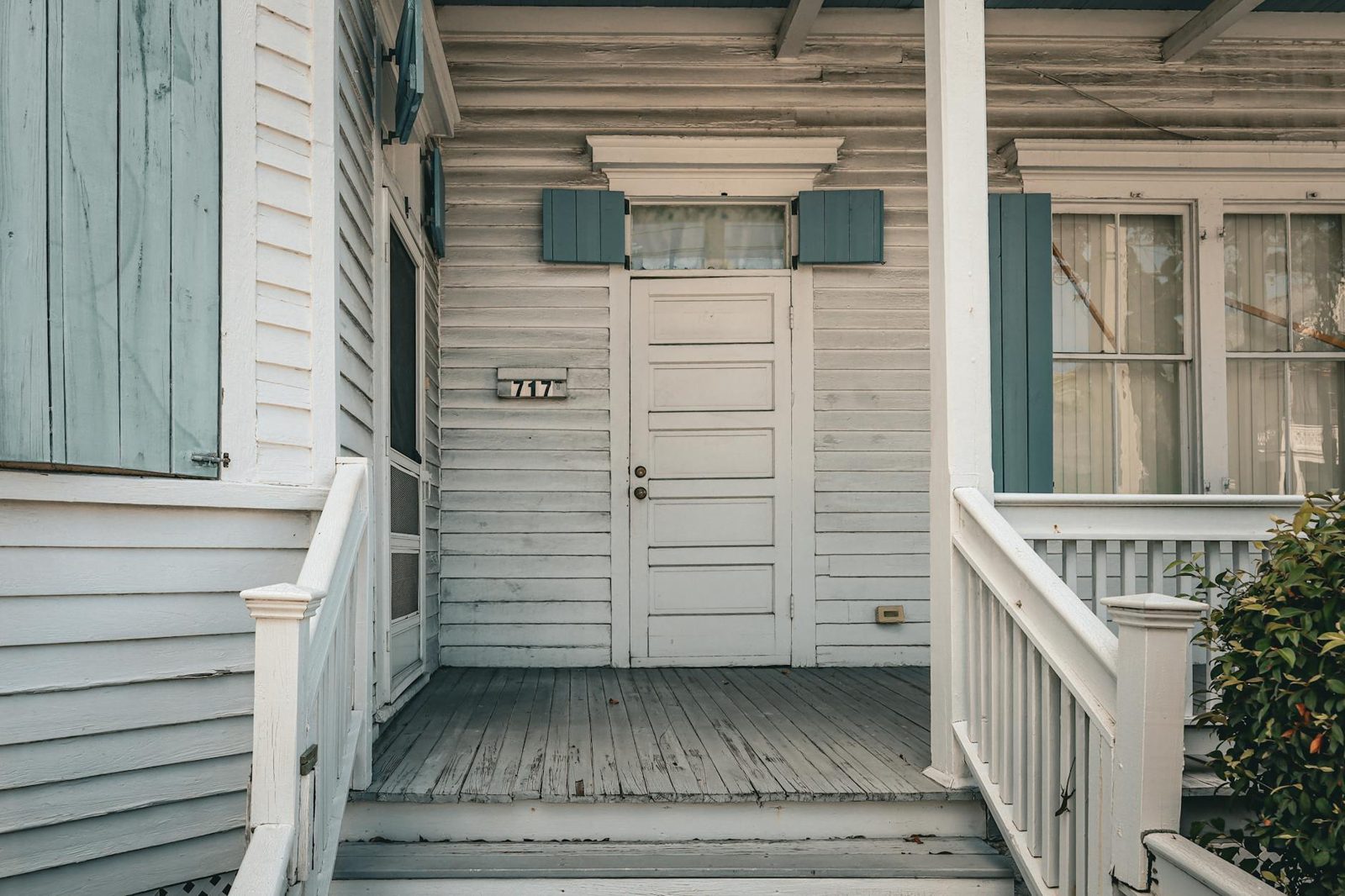 Coastal home with covered porch and storm-rated construction typical of the southeastern NC coast.