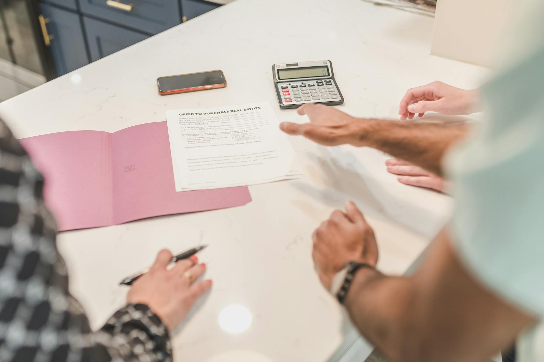 A pricing and comparable-sales analysis on a table — the data behind pricing a home accurately from day one.