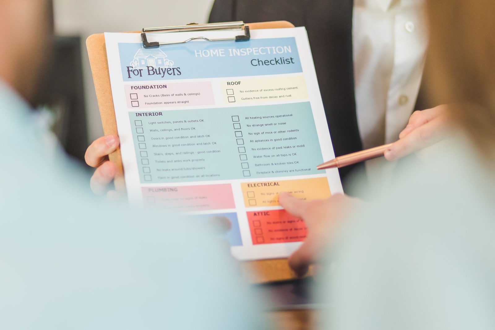 Home inspector with clipboard reviewing property checklist