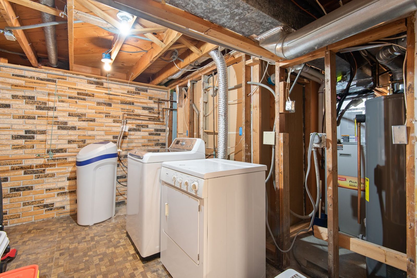Residential HVAC and water heater systems in a mechanical room representing home maintenance planning