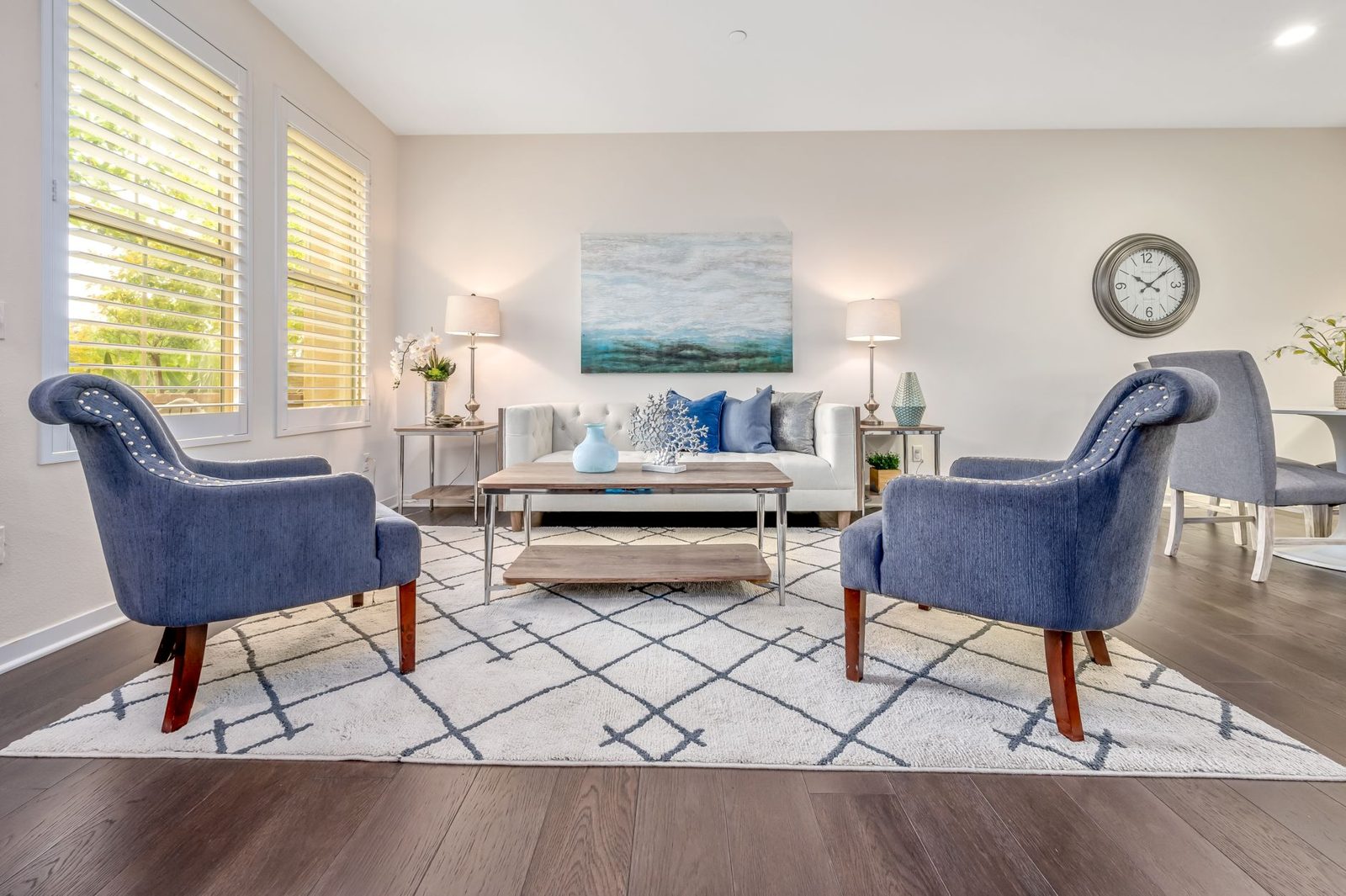 A bright, decluttered, staged living room — presentation that helps buyers picture their own life in the space.