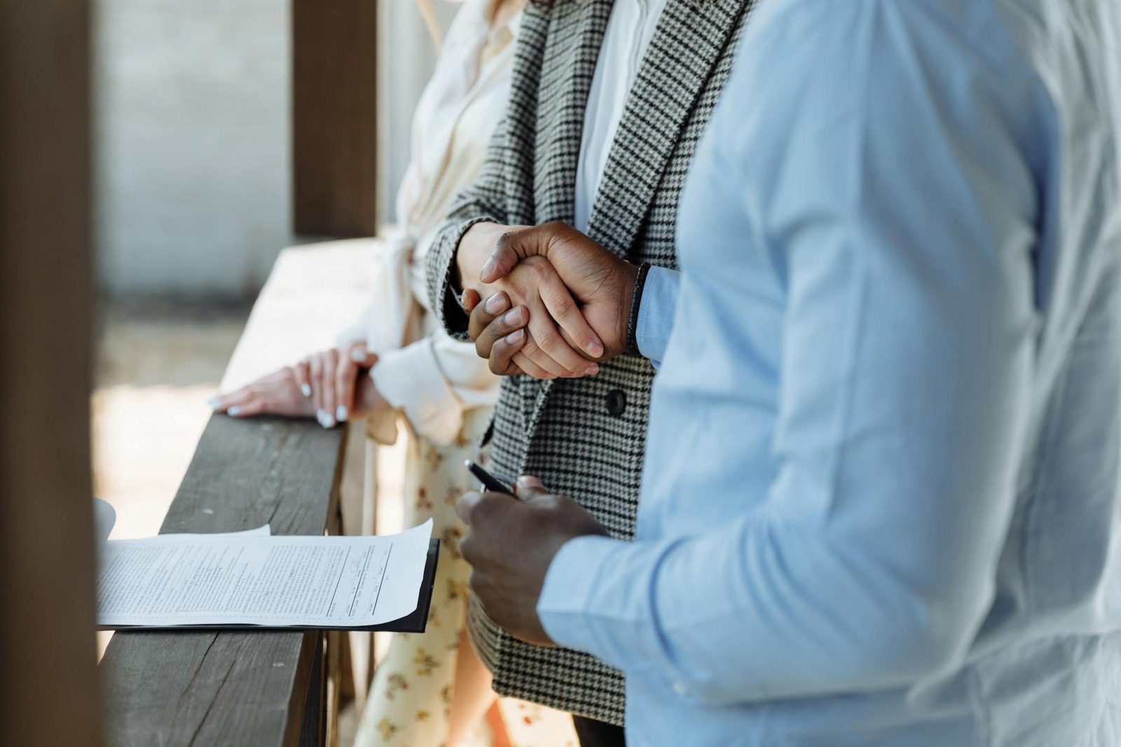 A skilled real estate agent reviewing a contract and negotiating on behalf of clients.