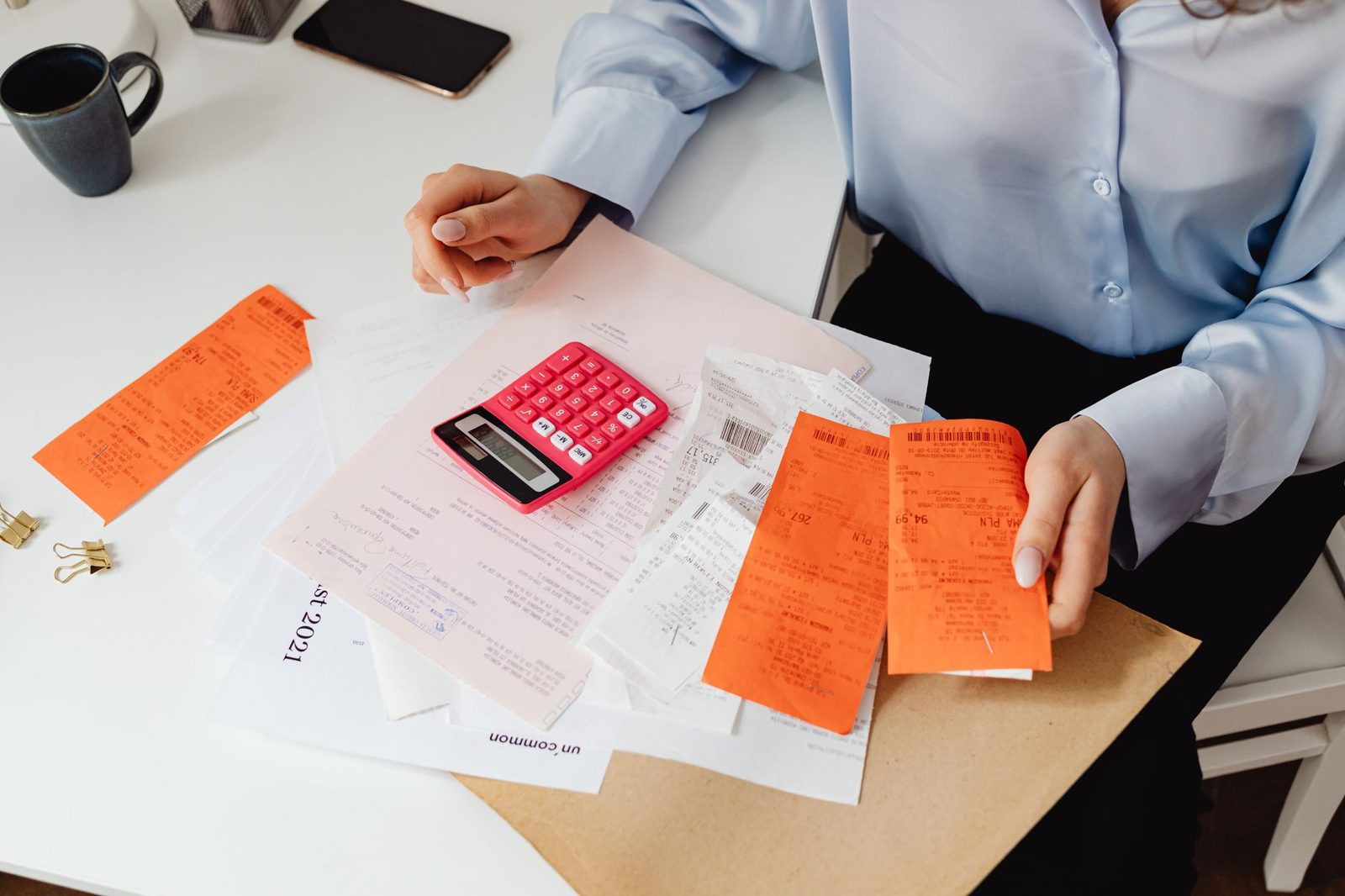 Homeowner organizing home maintenance receipts and documentation