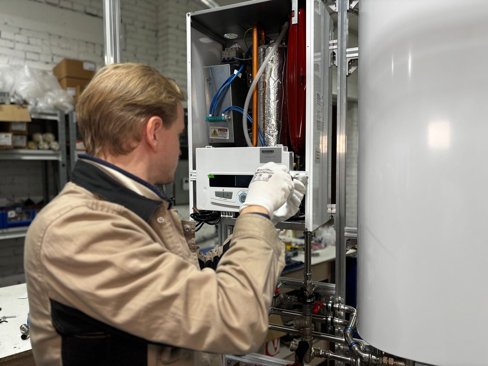 Technician repairing a water heater representing a home warranty service call