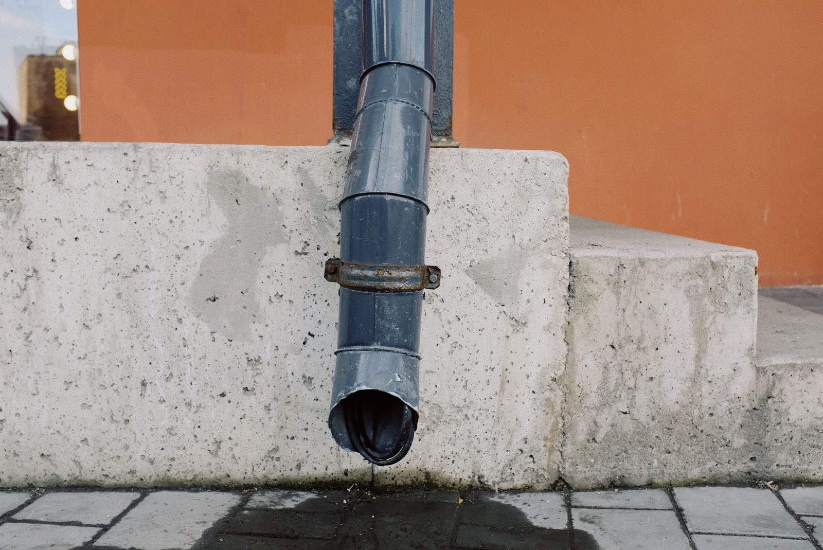 Downspout extension directing rainwater away from a home's foundation