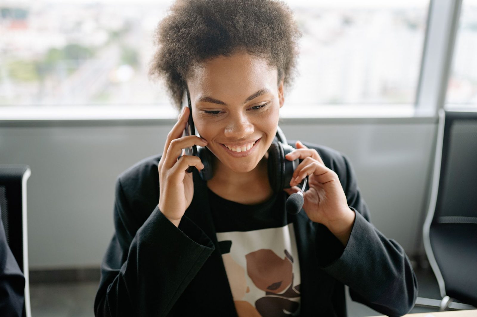 Insurance agent talking on the phone with a client about a policy quote.