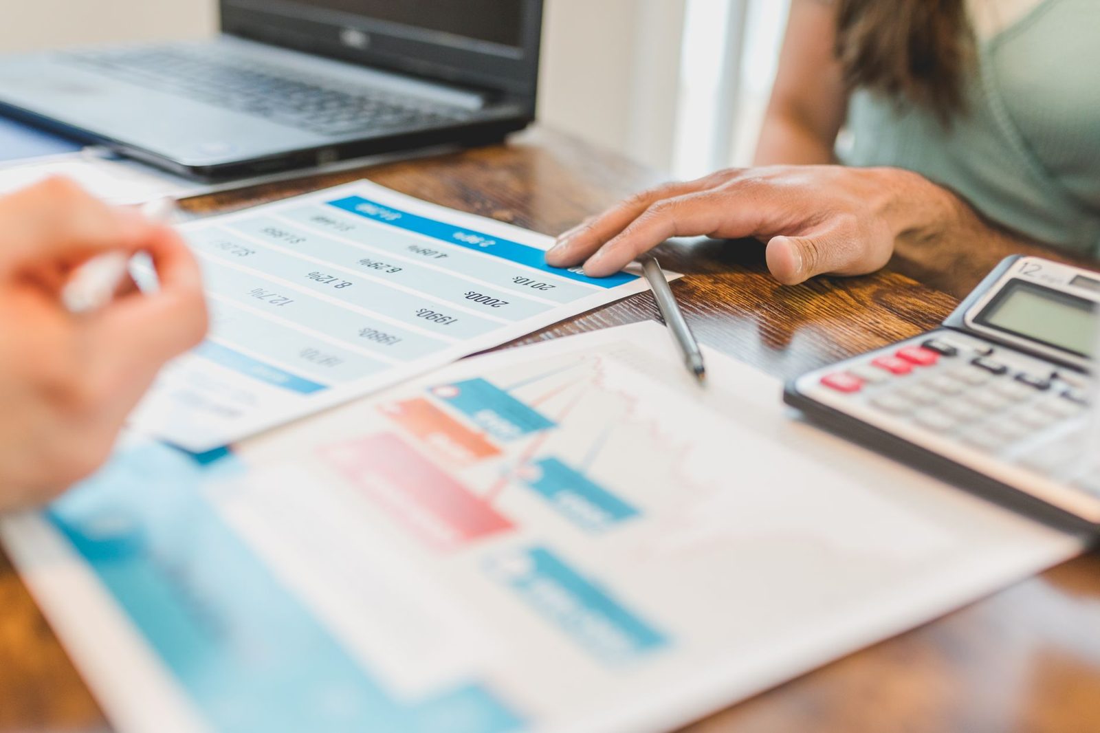 Real estate agent reviewing comparable home sales data and reports