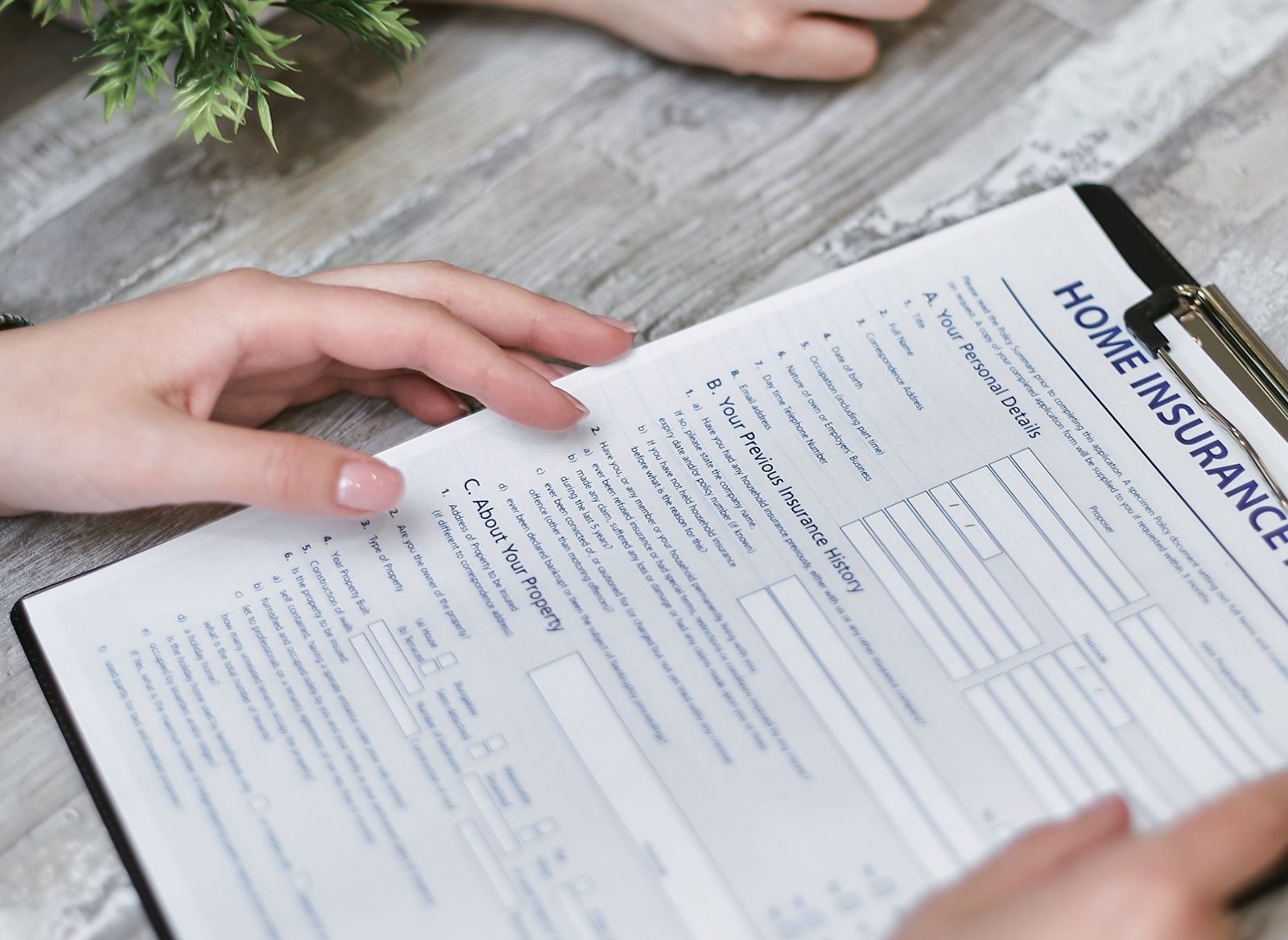 Homeowner reviewing an insurance settlement offer and paperwork