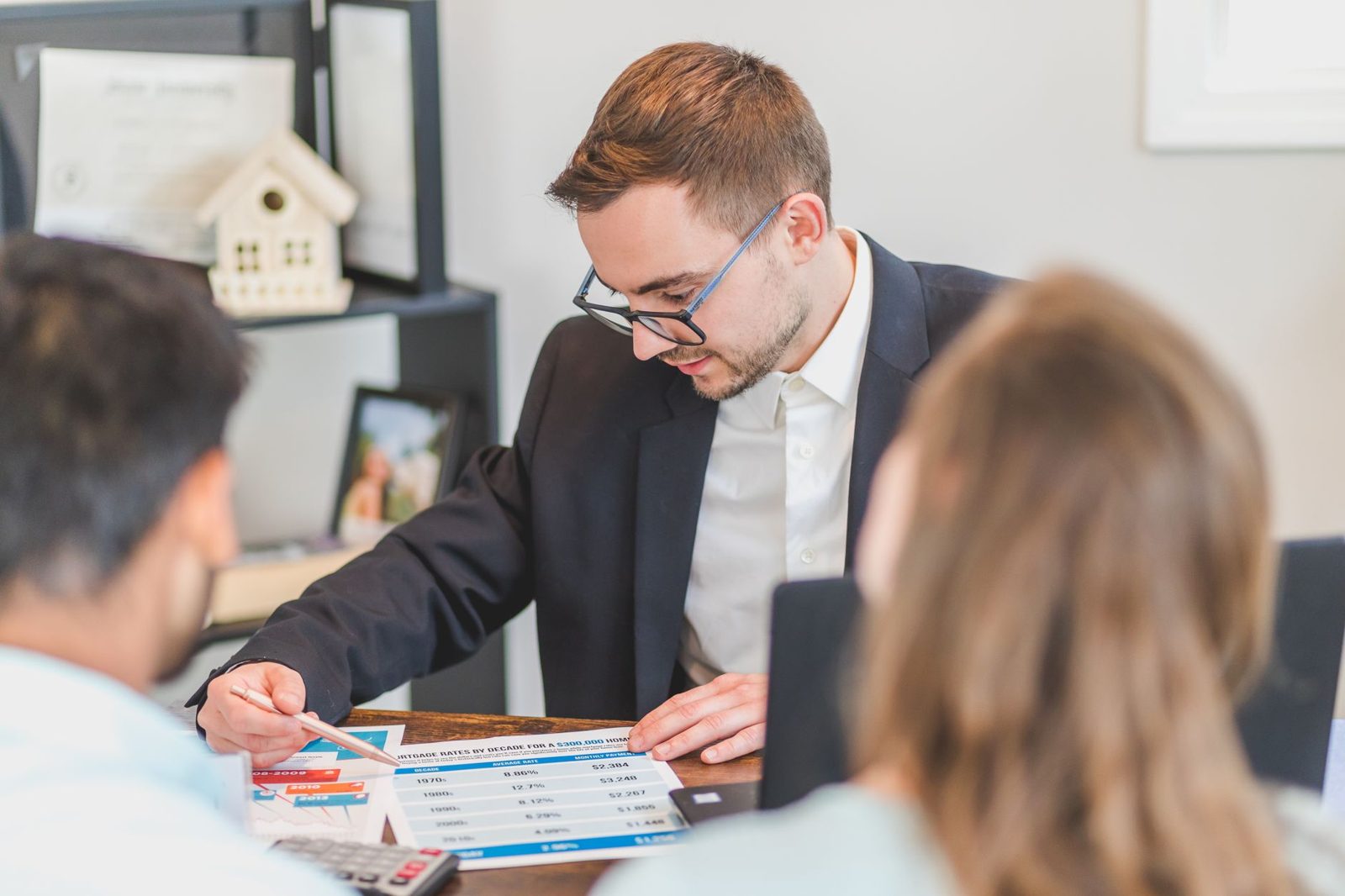 Loan officer explaining mortgage terms and rate caps to clients