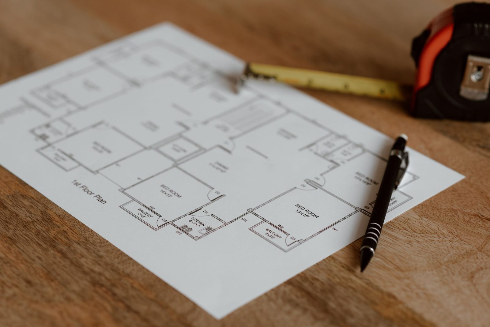 Builder sales office with floor plans on desk