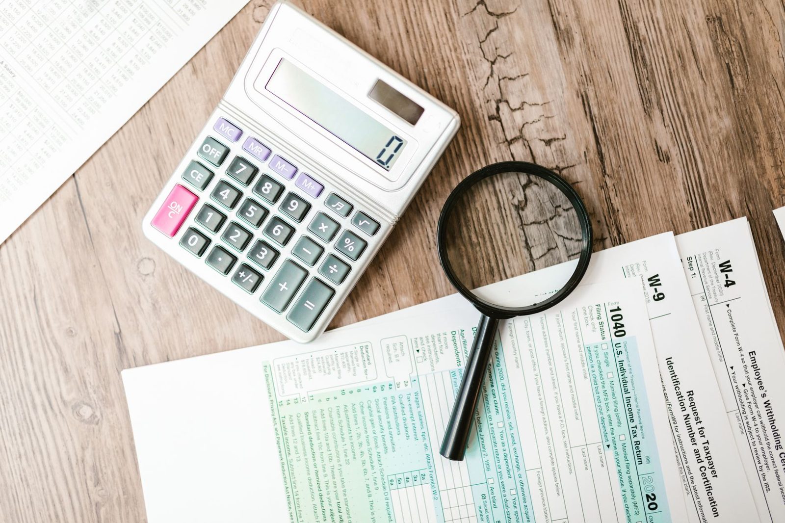 Tax return documents and calculator on a desk