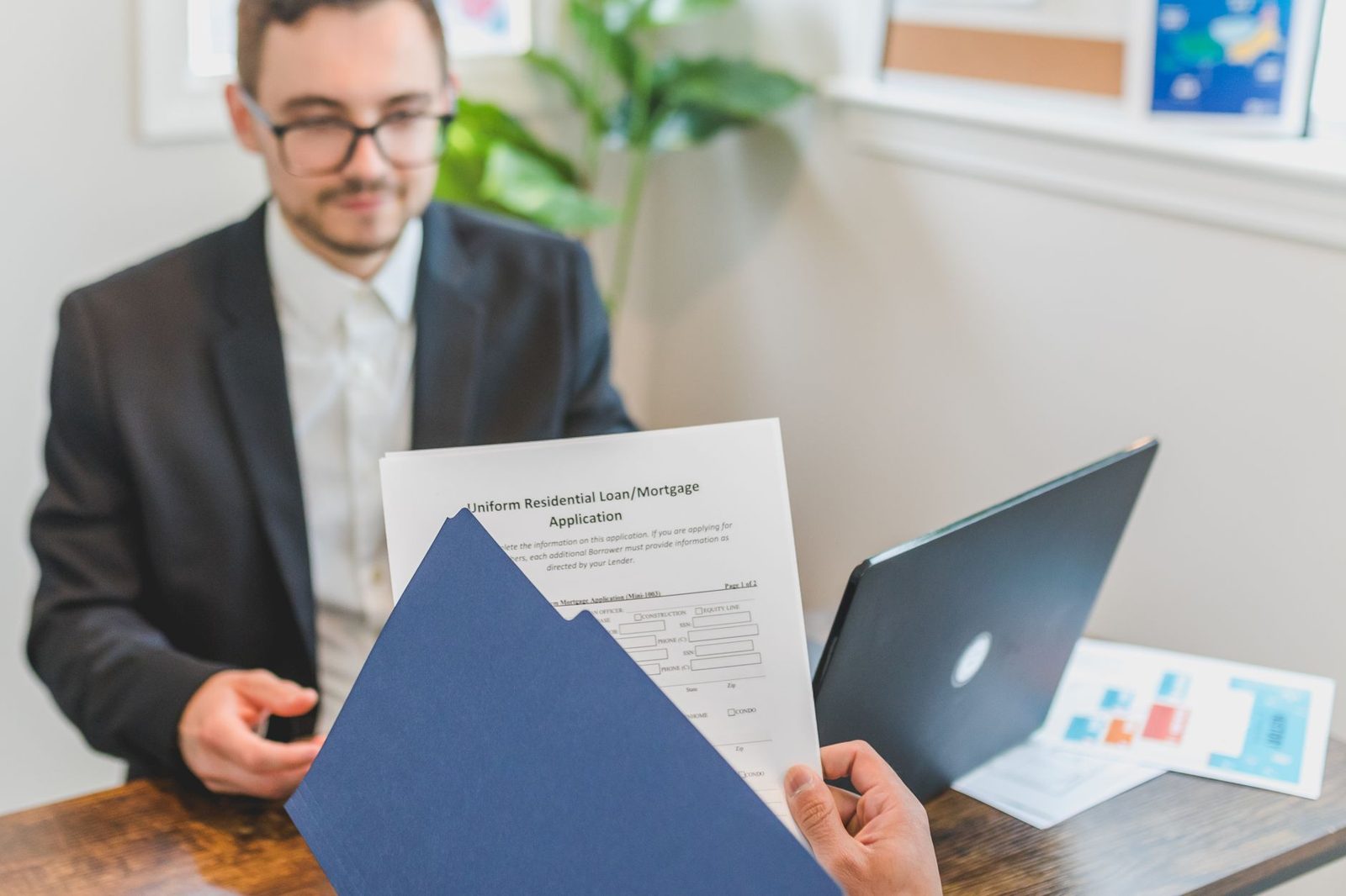 Loan officer meeting with a self-employed client in an office