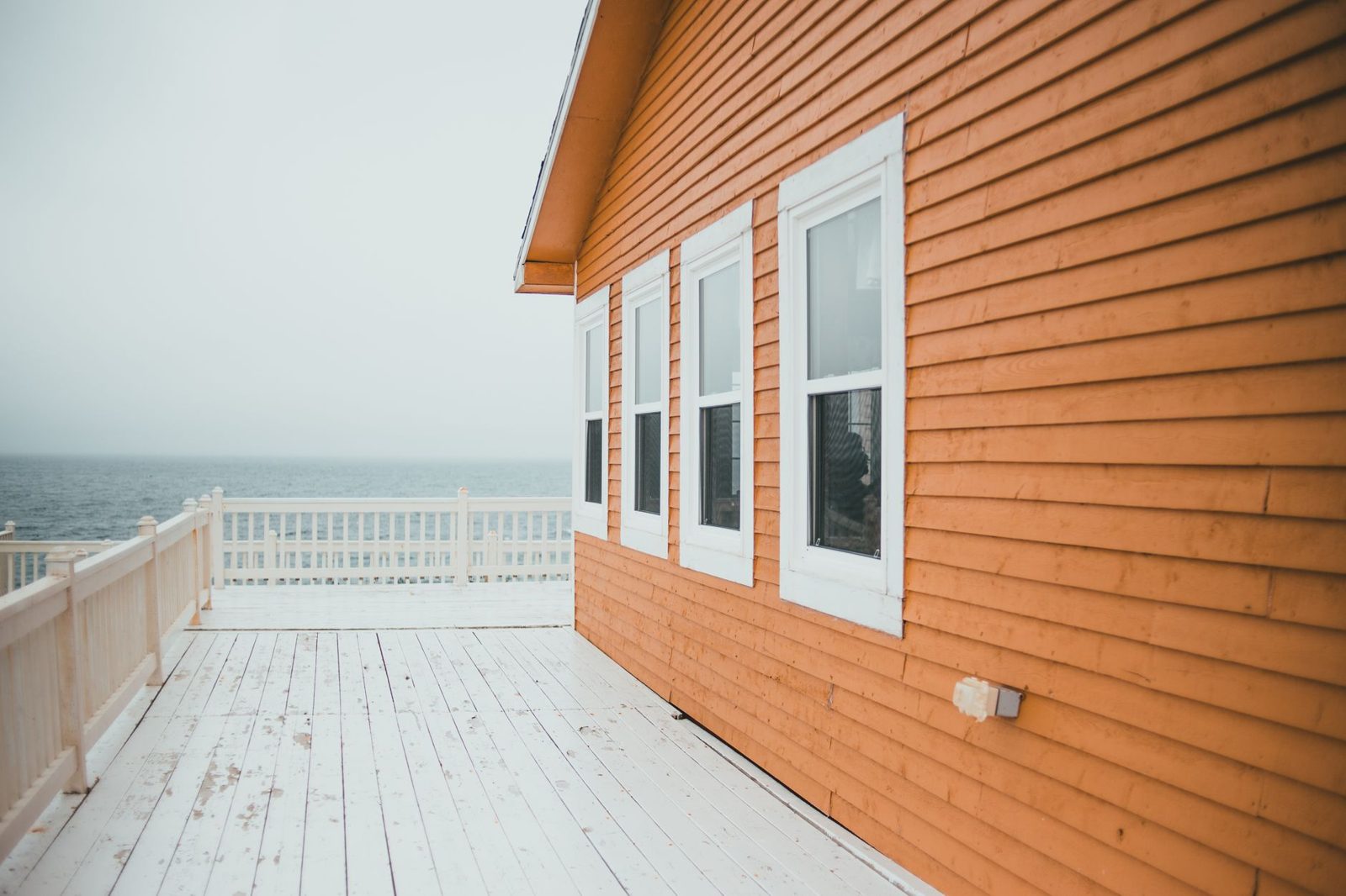Coastal home exterior showing weathered siding